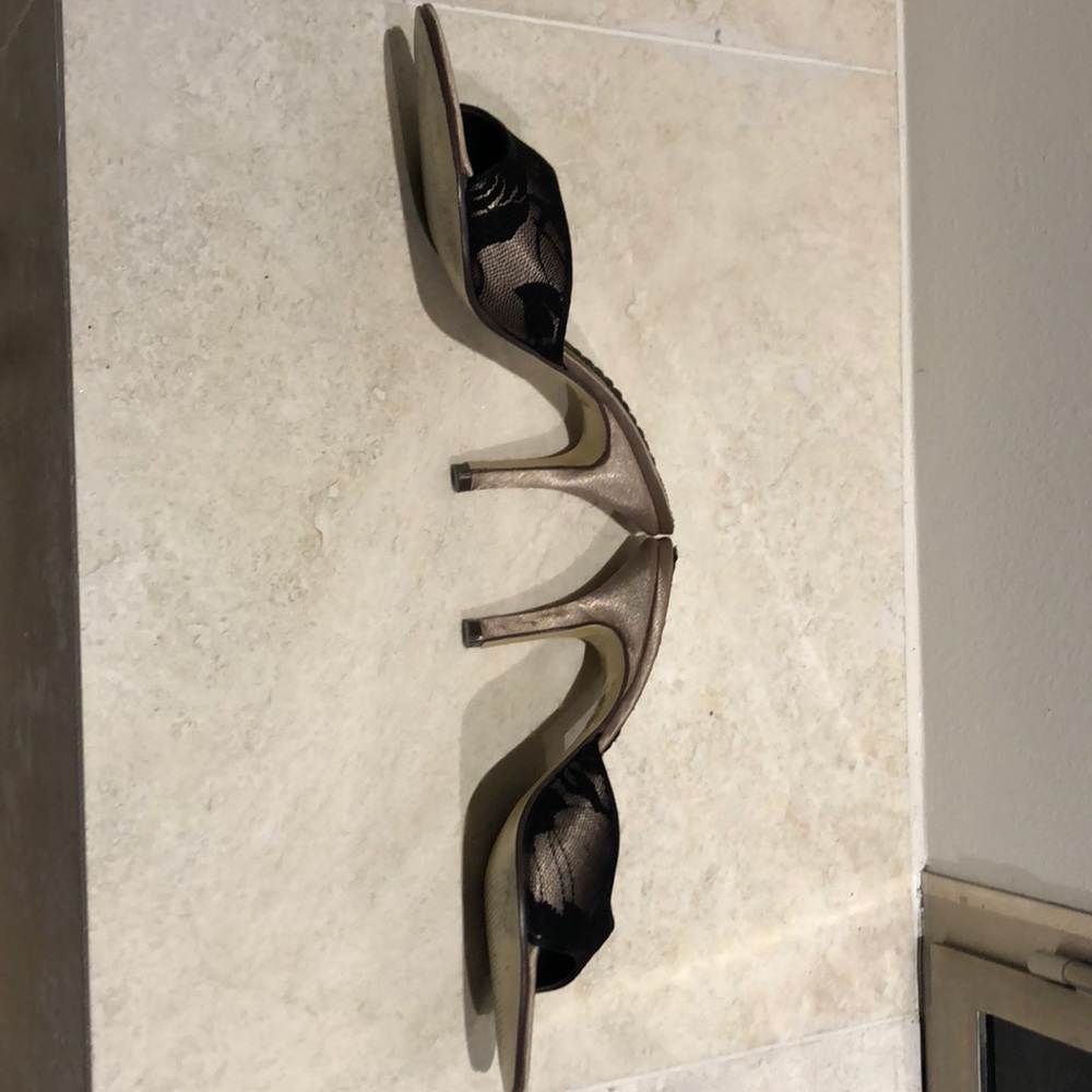 Black lace high heel slides.